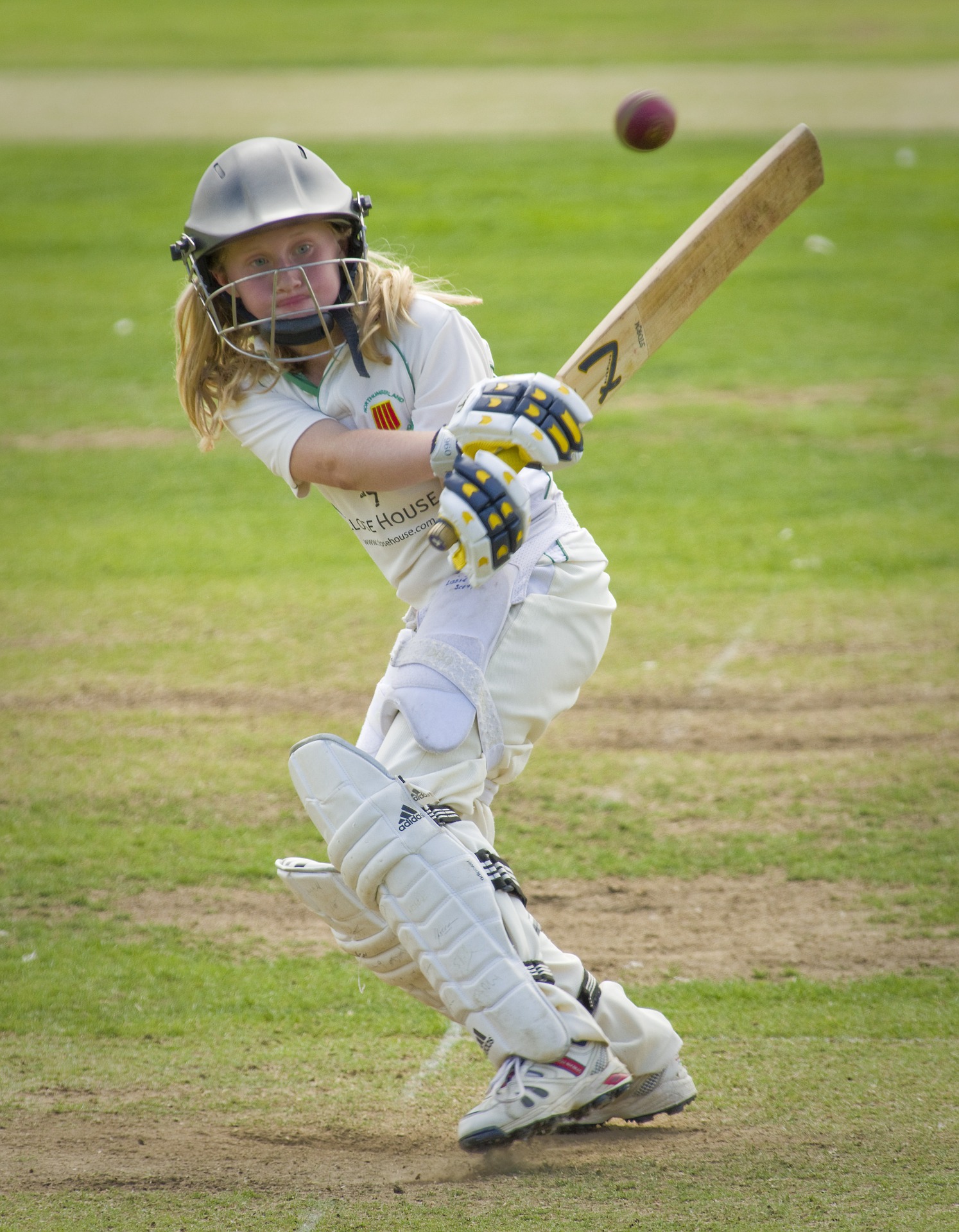 Girl playing cricket
