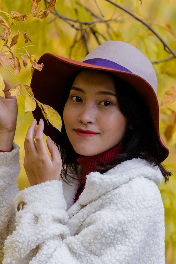 Xao Holding Leaves Fall Photoshoot