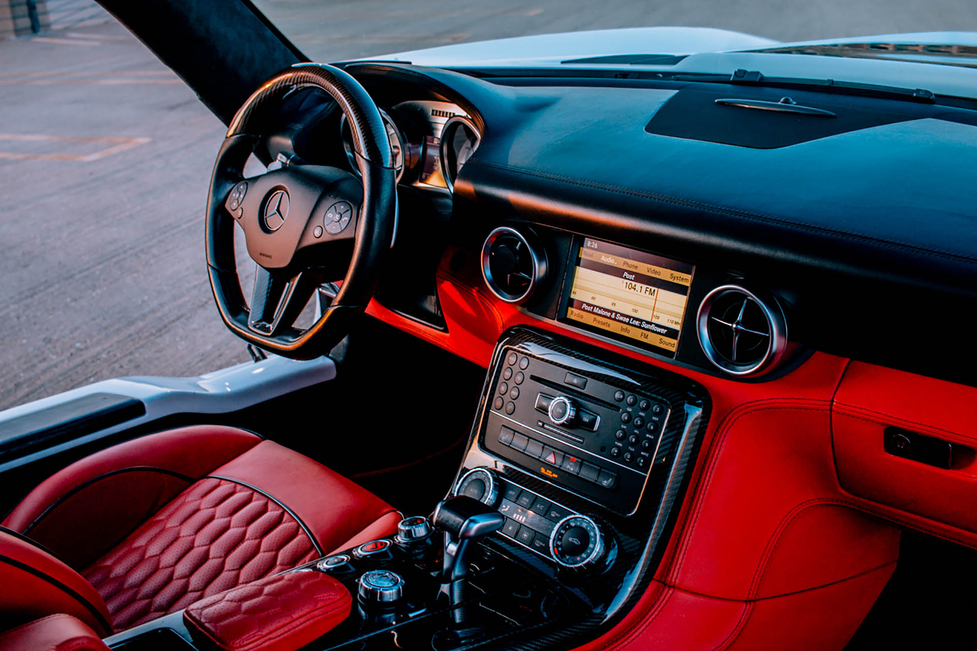 Vibrant red interior of a modern Mercedes Benz vehicle.