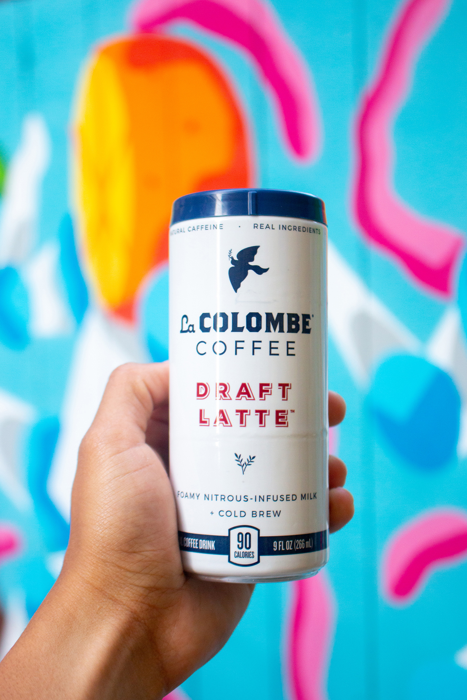 La Colombe Coffee in front of mural